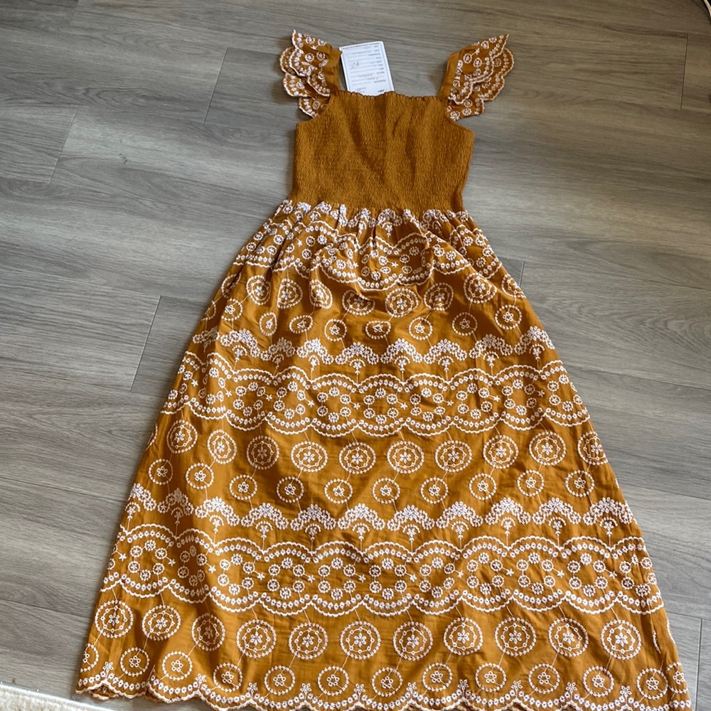 Beautiful summer address mustard and white color size medium for every day.